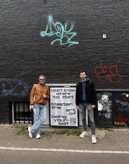 Street view of Decades Collective posters displayed in public space surrounded by people, featuring experimental typography and visual identity by Conversation Taking Place. Immo Schneider Conversation Taking Place CTP. TP. P.